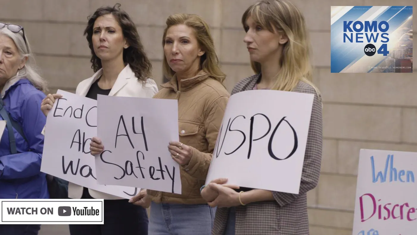 KOMO News footage of advocates holding signs reading “End Child Abuse WA”, “A4 Safety” and “NSPO”